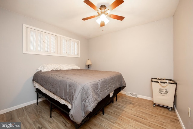 bedroom featuring light wood-type flooring and ceiling fan