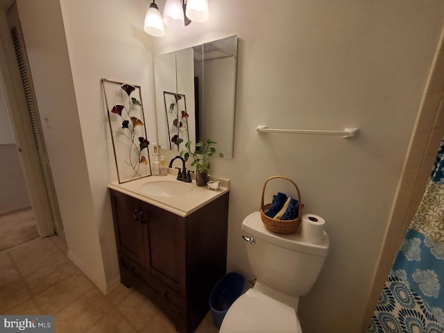 bathroom featuring toilet, tile patterned flooring, a shower with curtain, and vanity