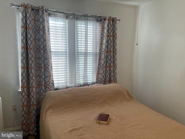 bedroom featuring multiple windows