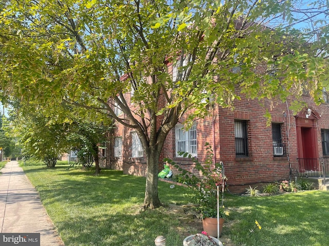 view of home's exterior featuring a yard