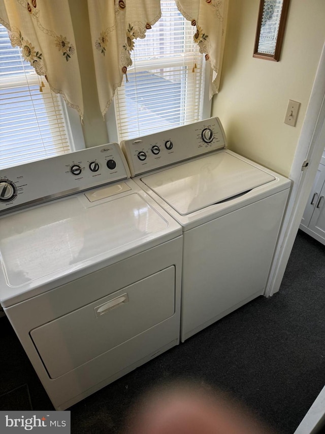 laundry area with washer and clothes dryer and carpet flooring