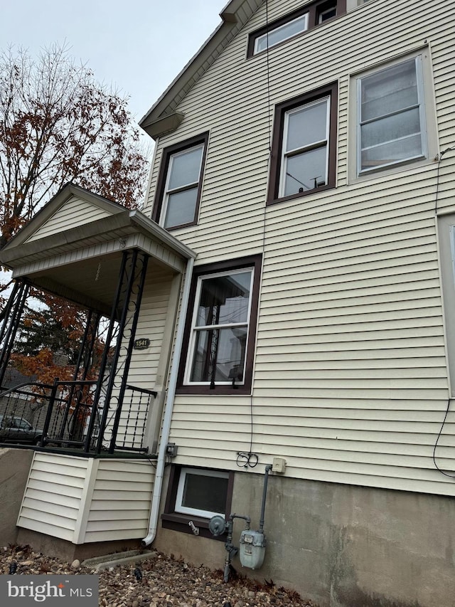 view of side of property featuring a porch