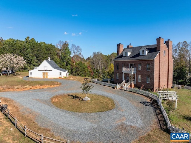 2004 Seven Meadows Ln, Appomattox, VA 24522 - view of front facade featuring a chimney, a balcony, curved driveway, and a barn