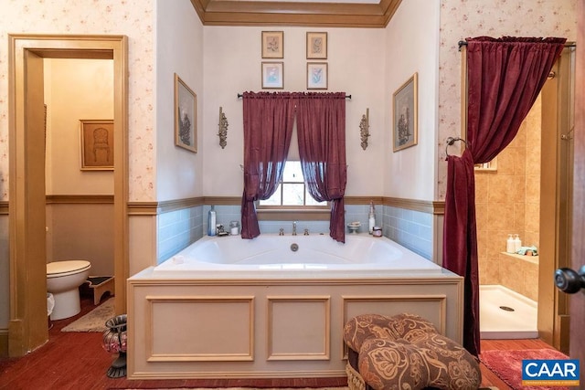 bathroom with hardwood / wood-style floors, toilet, ornamental molding, and independent shower and bath