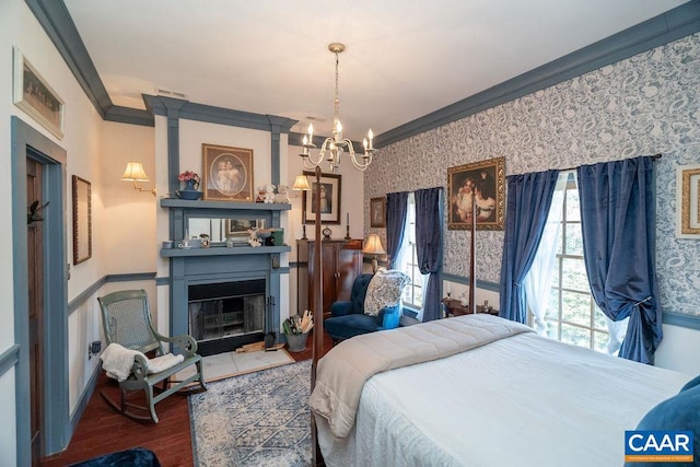 bedroom with crown molding, wood-type flooring, and an inviting chandelier