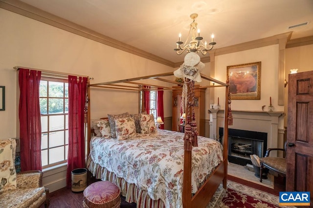 bedroom with a notable chandelier and crown molding