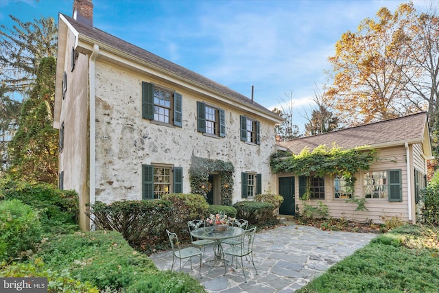 view of front facade with a patio area