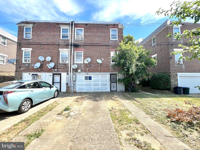 rear view of house with a garage