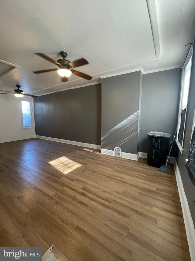 interior space featuring ornamental molding, hardwood / wood-style floors, and ceiling fan