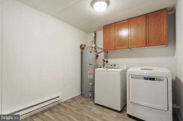 laundry area with cabinets, baseboard heating, independent washer and dryer, electric water heater, and light wood-type flooring