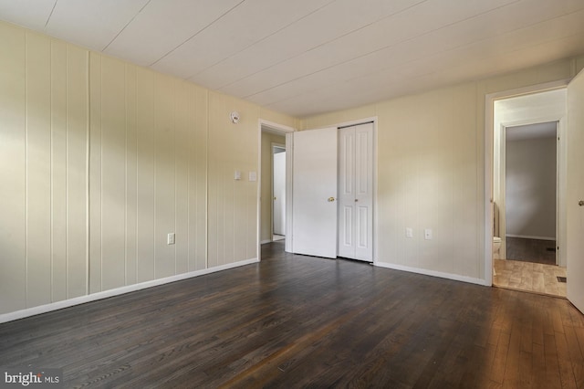 spare room featuring dark hardwood / wood-style floors