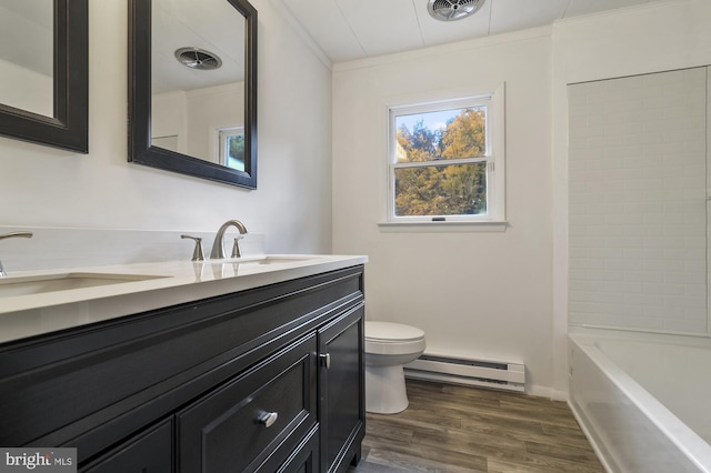 full bathroom with a baseboard radiator, wood-type flooring, toilet, vanity, and crown molding