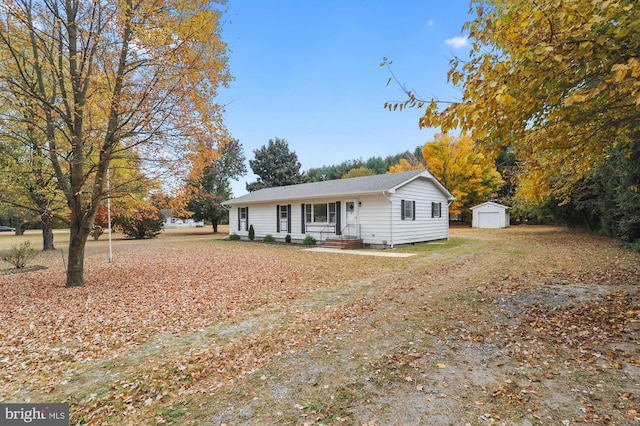 single story home featuring a storage unit