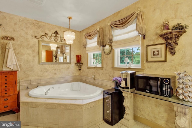 3121 Pineview Dr, Dover, PA 17315 - bathroom with tile patterned floors, a garden tub, and an inviting chandelier