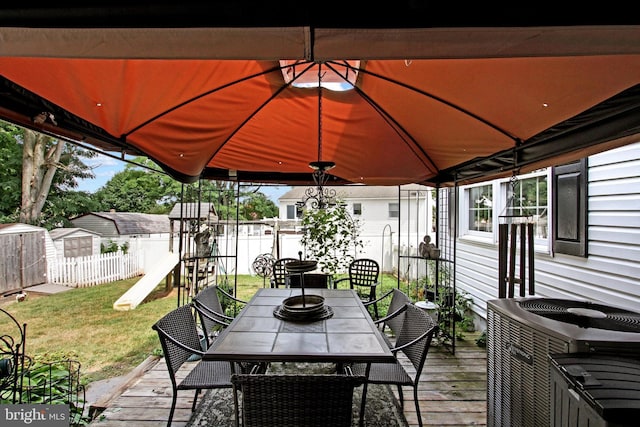 3121 Pineview Dr, Dover, PA 17315 - deck featuring a lawn, outdoor dining space, a shed, central air condition unit, and a fenced backyard