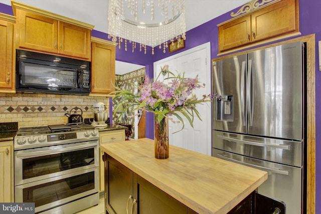 3121 Pineview Dr, Dover, PA 17315 - kitchen featuring wood counters, brown cabinets, stainless steel appliances, and decorative backsplash