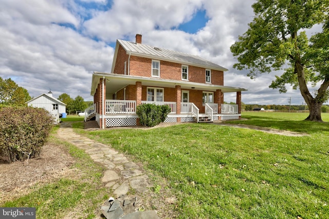 view of front of property with a front lawn and a porch