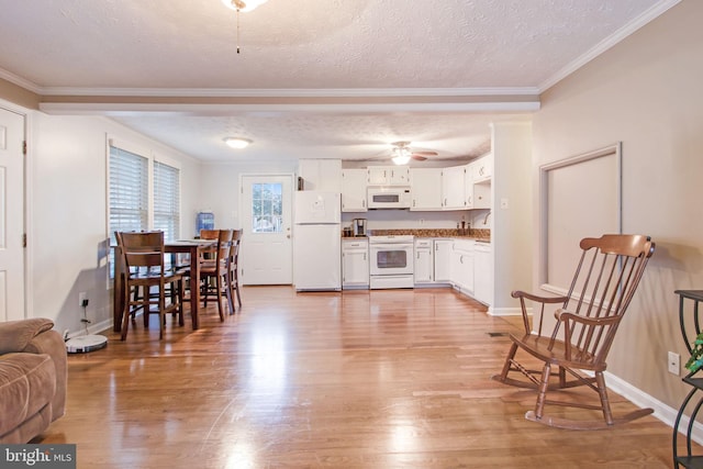 living room featuring crown molding, light wood-type flooring, and a textured ceiling