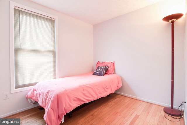 bedroom with light wood-type flooring