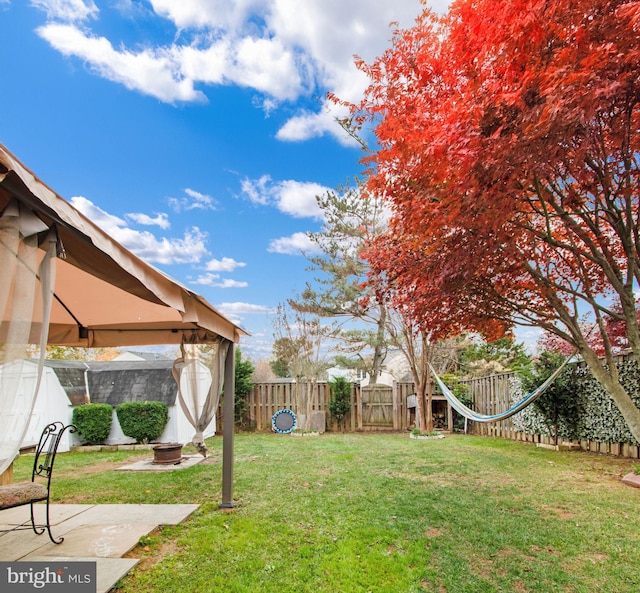 view of yard featuring a gazebo and a patio area