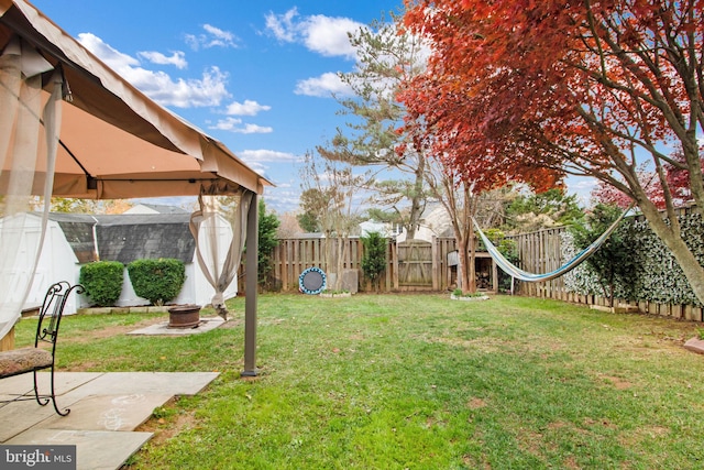 view of yard featuring a gazebo and a patio area