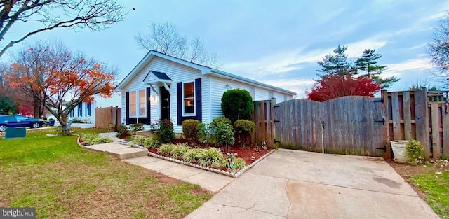 view of side of home featuring a lawn