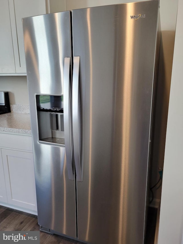 kitchen with white cabinetry, stainless steel fridge with ice dispenser, and dark hardwood / wood-style flooring