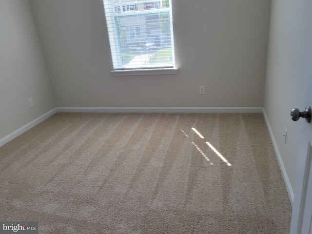 unfurnished room with carpet floors