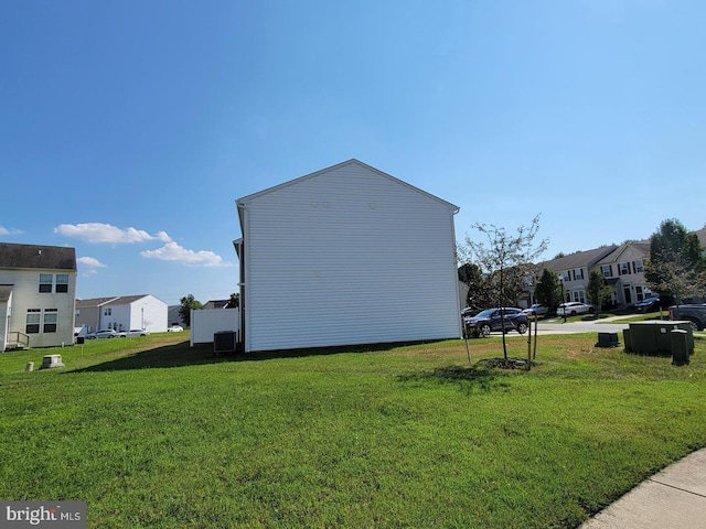 view of side of home featuring a yard