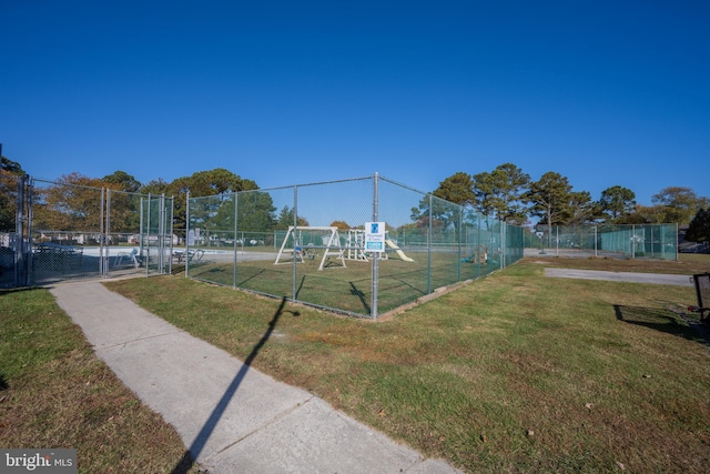 view of home's community with a yard