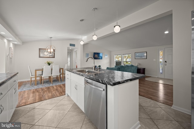 kitchen featuring dishwasher, sink, pendant lighting, a kitchen island with sink, and light wood-type flooring