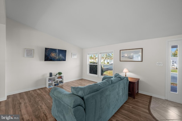 living room with lofted ceiling and dark wood-type flooring