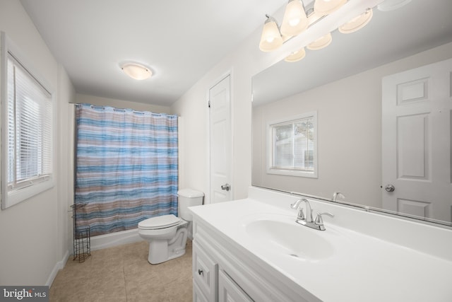 bathroom with tile patterned flooring, vanity, a shower with shower curtain, and toilet