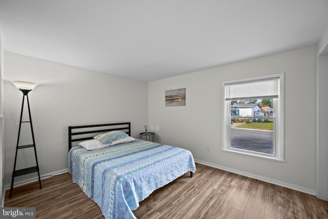 bedroom featuring dark hardwood / wood-style flooring