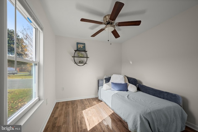 bedroom with hardwood / wood-style flooring and ceiling fan