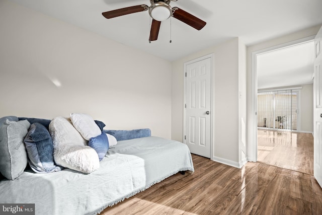 bedroom featuring ceiling fan and hardwood / wood-style flooring