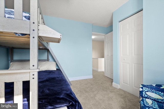 bedroom with a closet and carpet floors