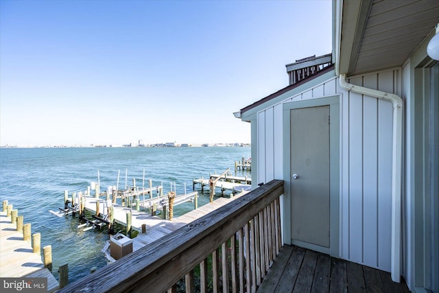 exterior space with a water view and a boat dock