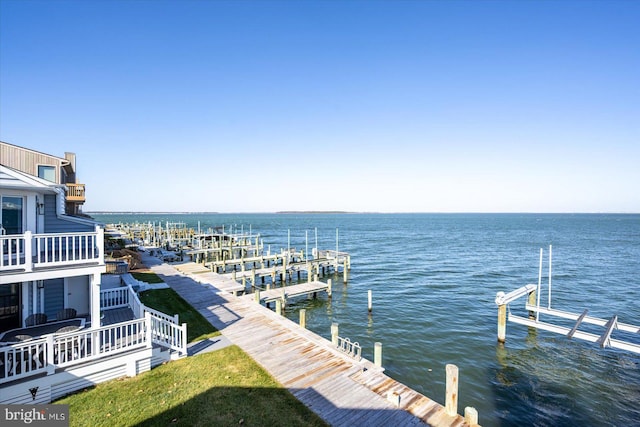 view of dock with a water view and a balcony