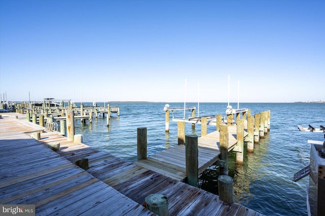 view of dock with a water view