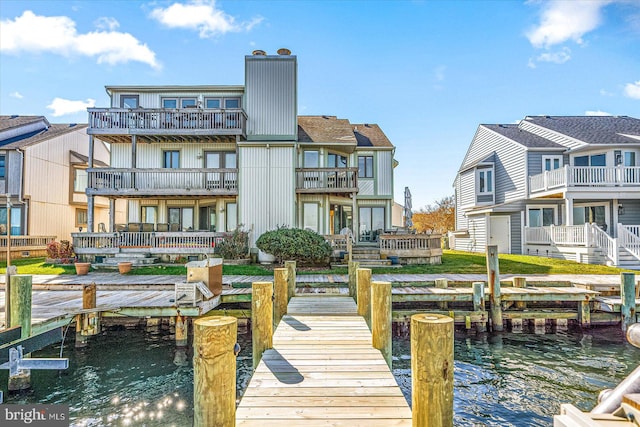 exterior space featuring a water view and a balcony