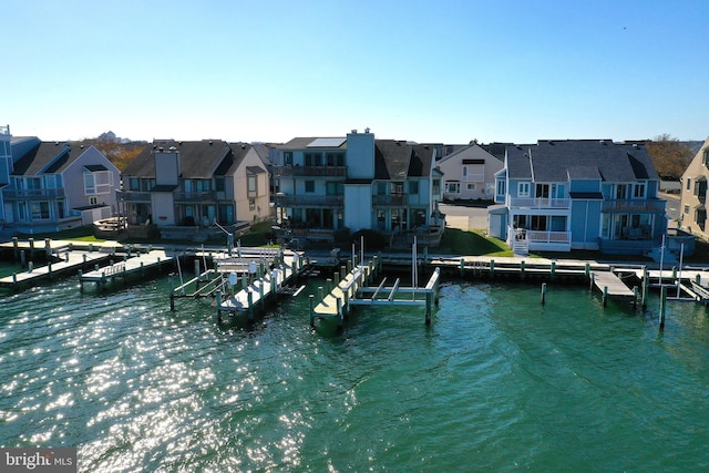 exterior space featuring a water view and a balcony