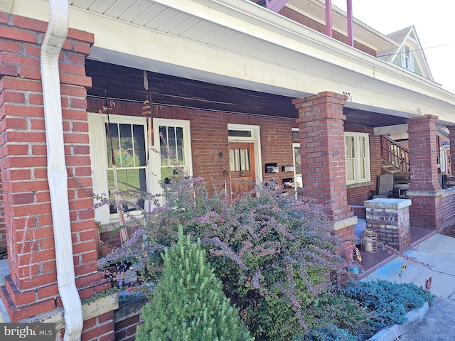 doorway to property featuring a porch