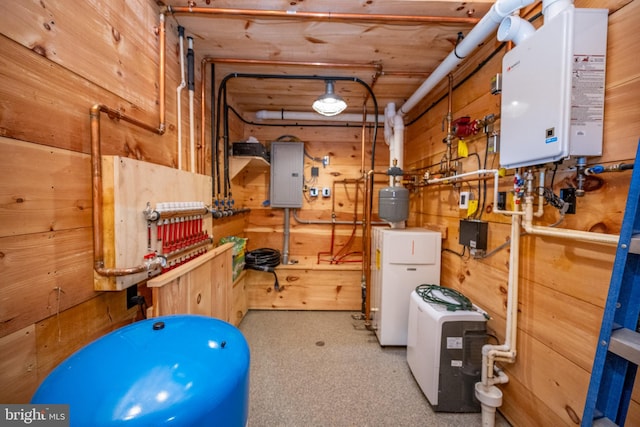 utility room with electric panel and tankless water heater