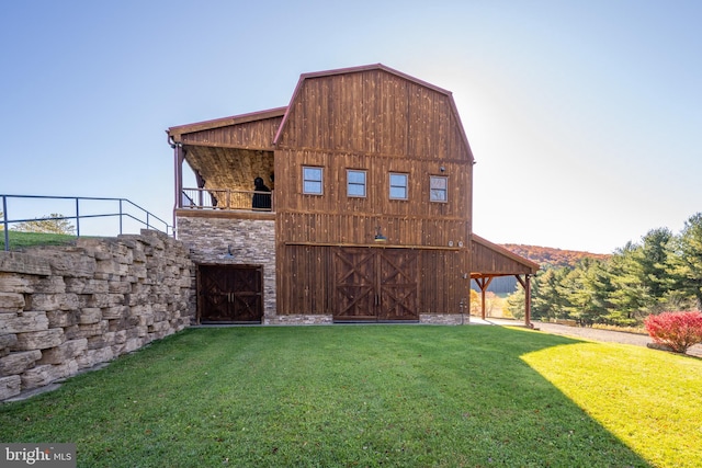 back of house with a lawn