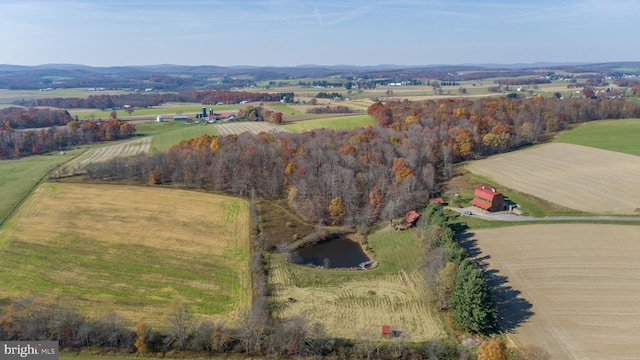 birds eye view of property with a rural view