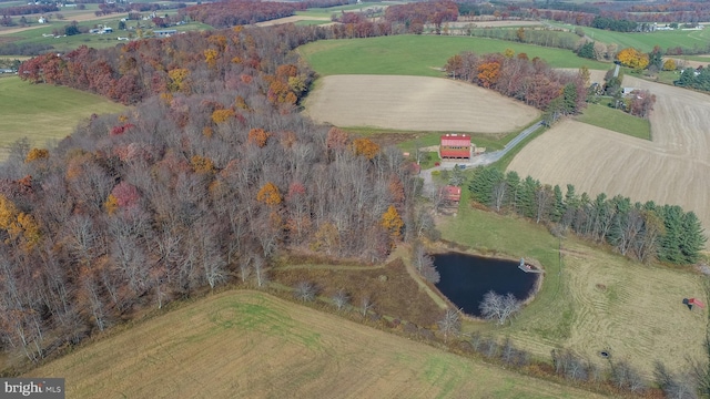 drone / aerial view featuring a rural view and a water view