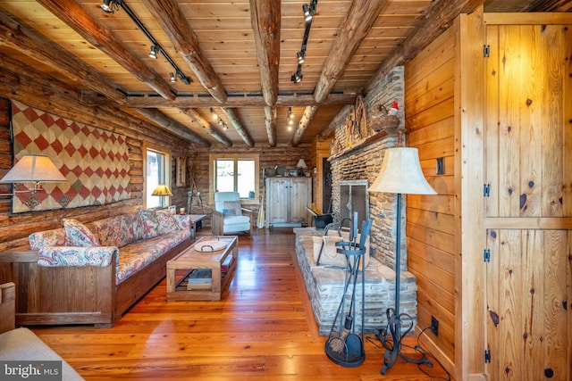 living room with wooden ceiling, wood-type flooring, beamed ceiling, and rail lighting