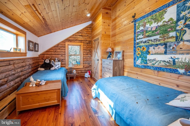 bedroom with hardwood / wood-style flooring, multiple windows, vaulted ceiling, and wooden ceiling