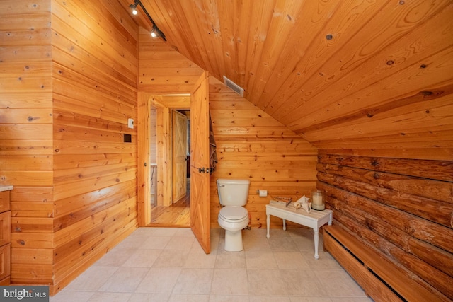 bathroom featuring wood walls, lofted ceiling, toilet, and wood ceiling